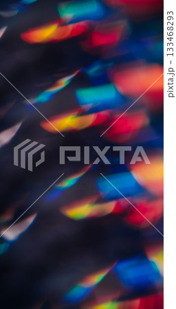 Blur night flare. Prism glow. Bright colorful kaleidoscopic light on dark background. Reflection effect abstract red orange blue rays. Blur night flare. Prism glow. Bright colorful kaleidoscopic light on dark background. Reflection effect abstract red orange blue rays. 133468293