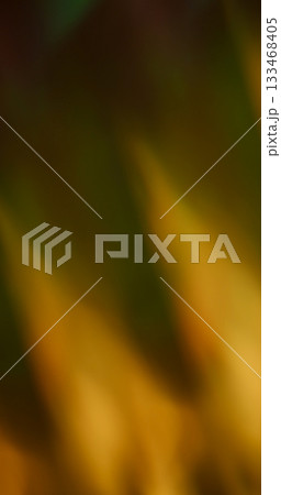 Defocused film ray. Warm flare texture. Yellow orange zigzag glow on black background. Art abstract color prism flame illumination. Defocused film ray. Warm flare texture. Yellow orange zigzag glow on black background. Art abstract color prism flame illumination. 133468405