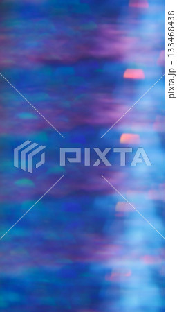 Defocused crystal flash. Shimmering glow texture. Rainbow bokeh light mix color. Prism sparks abstract purple blue neon background. Defocused crystal flash. Shimmering glow texture. Rainbow bokeh light mix color. Prism sparks abstract purple blue neon background. 133468438