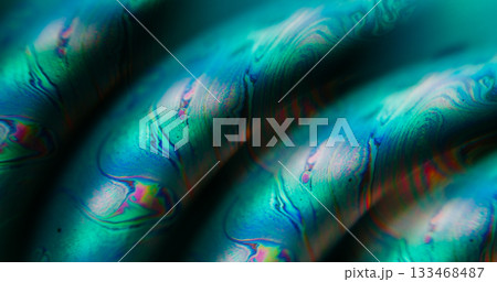 Defocused droplet texture. Gasoline leak. Green orange blue colorful flow paint acrylic bubble floating on abstract neon art background. 133468487