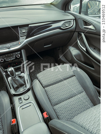 Modern vehicle interior showcasing sleek design and comfortable seating features in a contemporary setting Modern vehicle interior showcasing sleek design and comfortable seating features in a contemporary setting 133469512