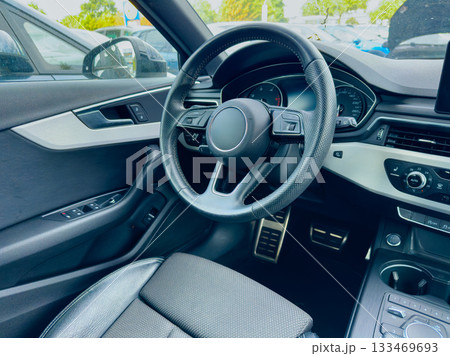 Driving experience captured in a modern car interior with sleek design and advanced technology 133469693
