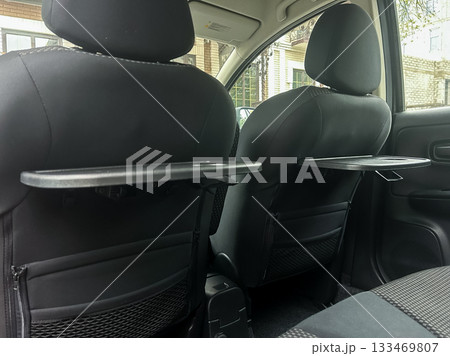 Innovative back seat organizers enhancing comfort and convenience during road trips and daily commutes in a compact car 133469807