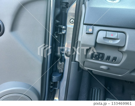 Detailed view of car door interior showcasing window controls and latch mechanism in a modern vehicle Detailed view of car door interior showcasing window controls and latch mechanism in a modern vehicle 133469961