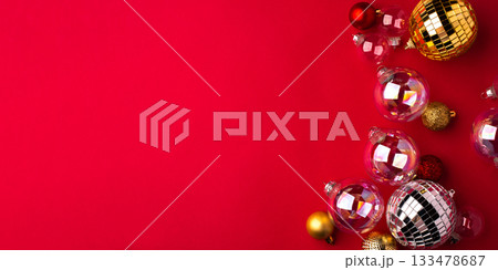 Festive Christmas ornaments on a red background. 133478687