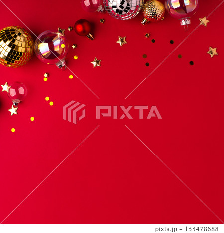 Festive Christmas ornaments on a red background. 133478688