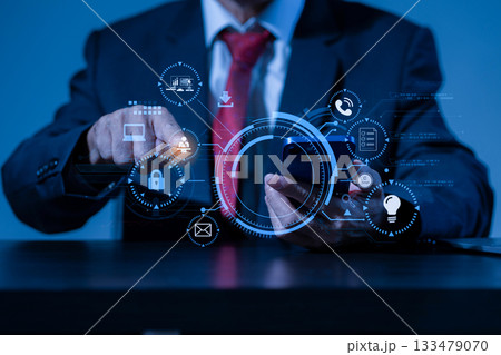 Copyright or patent concept, Person hand using laptop computer, tablet and smartphone with virtual screen copyright icon trademark, Creation ownership against piracy at office. Copyright or patent concept, Person hand using laptop computer, tablet and smartphone with virtual screen copyright icon trademark, Creation ownership against piracy at office. 133479070