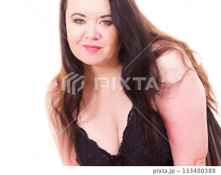 Woman in black lingerie showing her breast chest. 133480389