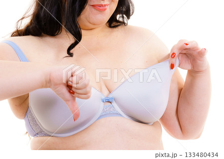 Woman big breast thumb down sign Woman big breast thumb down sign 133480434