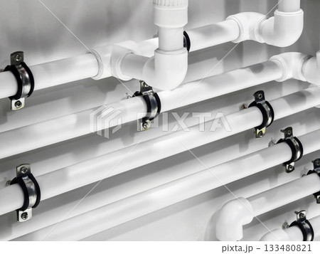 Pipes installed on a wall for plumbing system in modern building Pipes installed on a wall for plumbing system in modern building 133480821