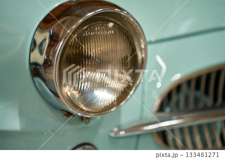 Retro car front details with headlight grill and chrome bumper Retro car front details with headlight grill and chrome bumper 133481271