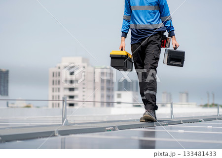 Engineer walking inspection solar panel installation on rooftop. 133481433