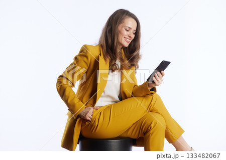 Focused Businesswoman Engaged with Smartphone Focused Businesswoman Engaged with Smartphone 133482067