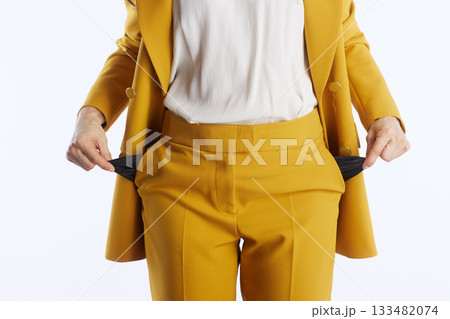 Empty Pockets Symbolizing Financial Hardship 133482074