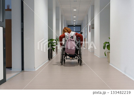 Teen student in wheelchair in inclusive school setting. 133482219