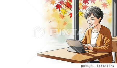 秋の陽射しを楽しむシニア女性とタブレット 133483173