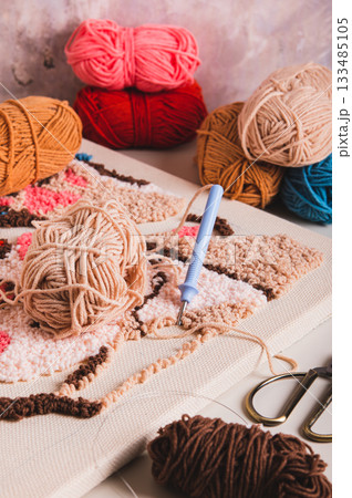 Carpet embroidery kit for crafting and relaxing on the table vertical view Carpet embroidery kit for crafting and relaxing on the table vertical view 133485105