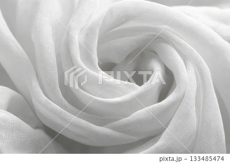 Elegant Close-Up of Luxurious White Silk Fabric with Beautiful Swirl Patterns in Soft Light Setting Elegant Close-Up of Luxurious White Silk Fabric with Beautiful Swirl Patterns in Soft Light Setting 133485474