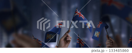 Falkland Islands flags in their hands on a blurred urban background 133485860
