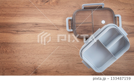 Modern empty lunchbox with compartments on wooden background, top view, copy space Modern empty lunchbox with compartments on wooden background, top view, copy space 133487159