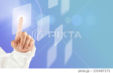 Hand touching virtual interface button on a futuristic digital screen 133487171