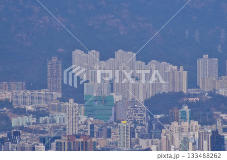 The view of Hong Kong cityscape from the Peak of Hong Kong. Beautiful and stunning view of Hong Kong. Hong Kong Cityscape and skyline.  133488262