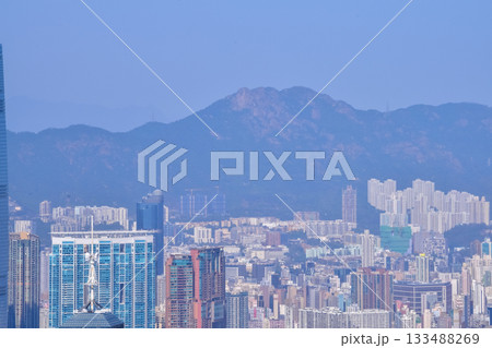 The view of Hong Kong cityscape from the Peak of Hong Kong. Beautiful and stunning view of Hong Kong. Hong Kong Cityscape and skyline.  133488269