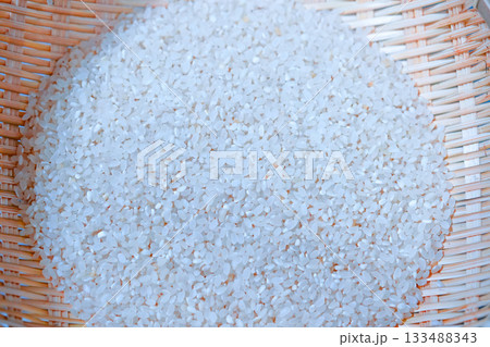 Rice grains in a wooden basket. Healthy natural food grown in Korea 133488343