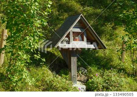 Traditional Wooden Wayside Shrine in Austrian Alps 133490505