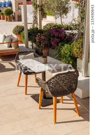 Cozy table on a Mediterranean restaurant terrace on a sunny day 133490643