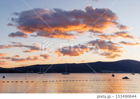 Sunset over the Bay of Kotor in Montenegro with calm sea Sunset over the Bay of Kotor in Montenegro with calm sea 133490644