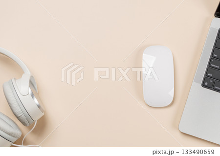 Laptop and stationery on beige workspace, top view with copy space Laptop and stationery on beige workspace, top view with copy space 133490659