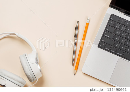 Laptop and stationery on beige workspace, top view with copy space Laptop and stationery on beige workspace, top view with copy space 133490661