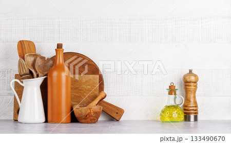 Kitchen utensils and spices on table 133490670