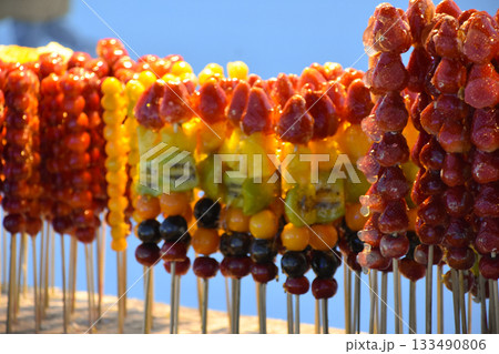 Brightly colored candied hawthorn berries at the Harbin Ice and Snow Festival Brightly colored candied hawthorn berries at the Harbin Ice and Snow Festival 133490806