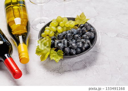 Wine bottles and fresh grapes Wine bottles and fresh grapes 133491168