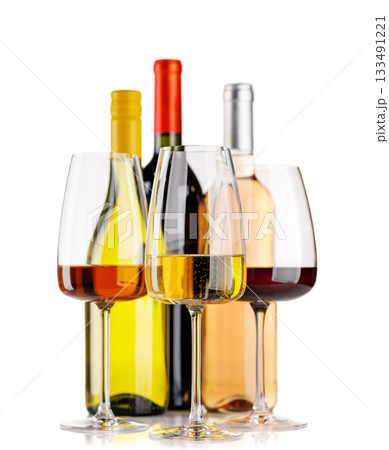 Different wine bottles and glasses on white background 133491221