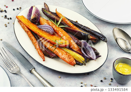 Healthy meal, seasoned roasted carrots. 133491584