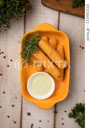 Crispy mozzarella sticks with dipping sauce Crispy mozzarella sticks with dipping sauce 133491818