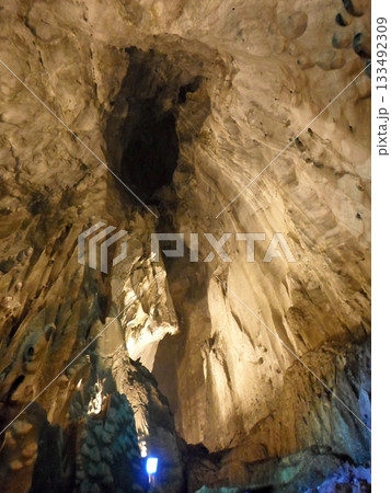 Illuminated Cave Interior Highlighting Dramatic Rock Formations 133492309