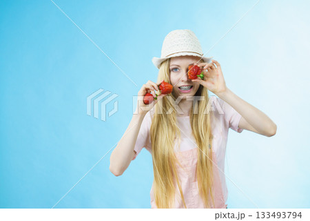 Young woman with fresh strawberries Young woman with fresh strawberries 133493794