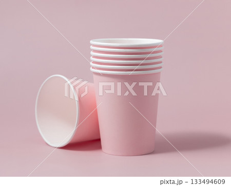 Disposable light pink paper cups closeup, mockup, copy space. No plastic biodegradable single-use Disposable light pink paper cups closeup, mockup, copy space. No plastic biodegradable single-use 133494609