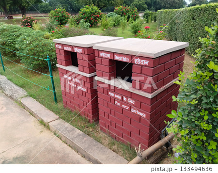 beautiful dustbin for wet garbage and dry garbage, made by concrete near park, ( written in English and Hindi language) 133494636