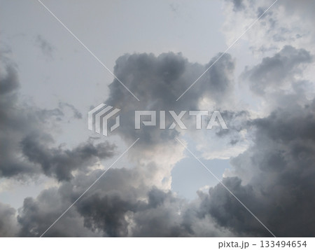 rain season clouds. Gray rain clouds loaded with rain in the sky. rain season clouds. Gray rain clouds loaded with rain in the sky. 133494654