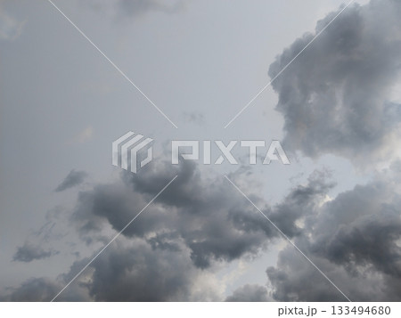 rain season clouds. Gray rain clouds loaded with rain in the sky. rain season clouds. Gray rain clouds loaded with rain in the sky. 133494680