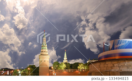 Moscow Kremlin (with decorations for the holiday of May 9 in honor of Victory Day celebration (WWII). Against the sky with clouds, Russia. TRANSLATION: Victory! 133494815