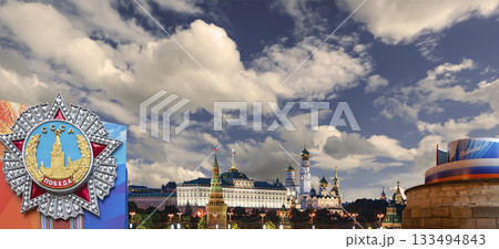 Moscow Kremlin (with decorations for the holiday of May 9 in honor of Victory Day celebration (WWII). Against the sky with clouds, Russia. TRANSLATION: USSR, Victory! Moscow Kremlin (with decorations for the holiday of May 9 in honor of Victory Day celebration (WWII). Against the sky with clouds, Russia. TRANSLATION: USSR, Victory! 133494843