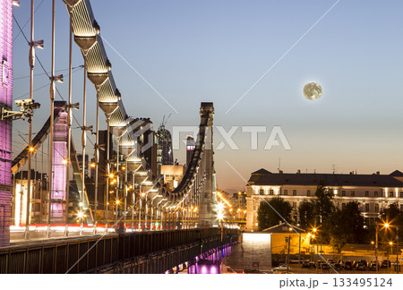Krymsky Bridge or Crimean Bridge (night, with the super moon) is a steel suspension bridge in Moscow, Russia. The bridge spans the Moskva River 1,800 metres south-west from the Kremlin 133495124