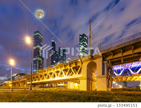 Moscow Central Circle (Little Ring, MCC,or MK MZD) and skyscrapers of the International Business Center (City) at night, with the super moon, Russia. Delovoy Tsentr  railway station 133495151