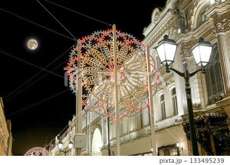 Christmas (New Year holidays) illumination on Nikolskaya Street near the Moscow Kremlin at night with the super moon, Russia Christmas (New Year holidays) illumination on Nikolskaya Street near the Moscow Kremlin at night with the super moon, Russia 133495239